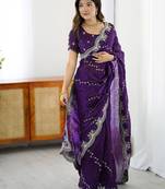 Purple ethnic motifs embroidered saree