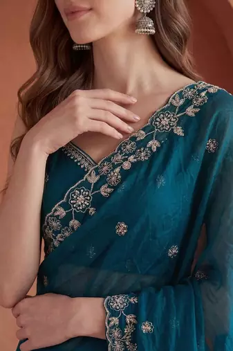Teal embroidered tissue saree