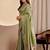 Green woven design zari saree with blouse piece