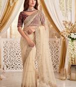 Cream embellished embroidered poly georgette heavy work saree