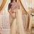 Cream embellished embroidered poly georgette heavy work saree