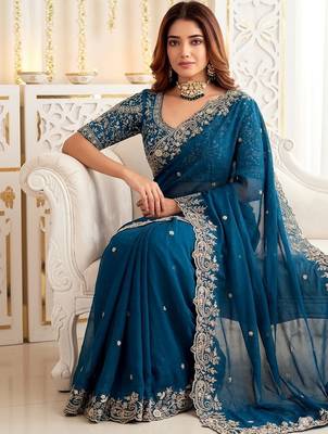 Teal embellished embroidered poly georgette heavy work saree 3