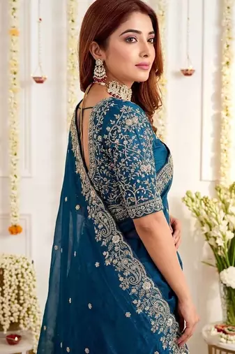 Teal embellished embroidered poly georgette heavy work saree