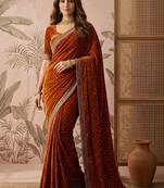 Rust embellished sequinned silk blend saree