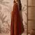 Rust embellished sequinned silk blend saree