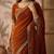 Rust embellished sequinned silk blend saree