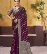 Burgundy ethnic motifs woven design zari  georgette saree with blouse piece