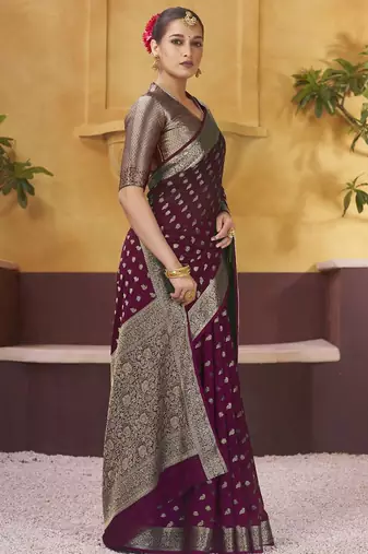 Burgundy ethnic motifs woven design zari  georgette saree with blouse piece