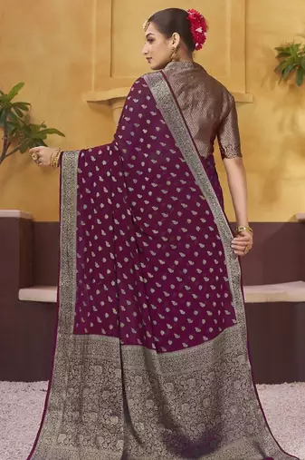 Burgundy ethnic motifs woven design zari  georgette saree with blouse piece