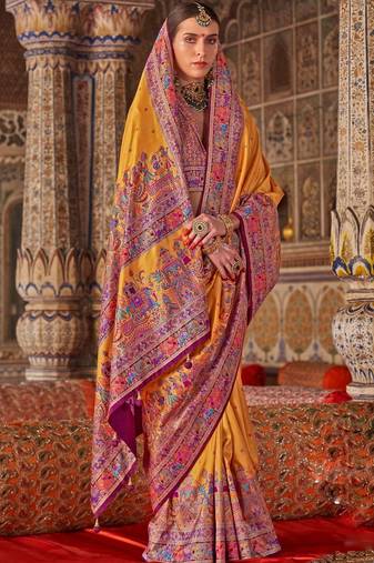Yellow ethnic motifs embroidered silk blend heavy work saree