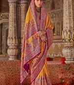 Yellow ethnic motifs embroidered silk blend heavy work saree
