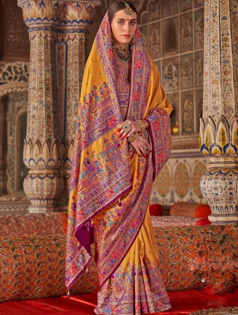 Yellow ethnic motifs embroidered silk blend heavy work saree