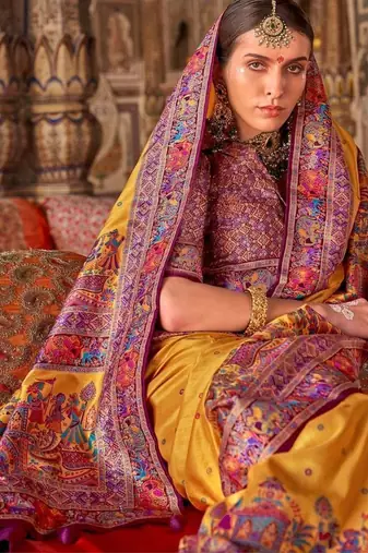 Yellow ethnic motifs embroidered silk blend heavy work saree