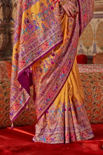 Yellow ethnic motifs embroidered silk blend heavy work saree