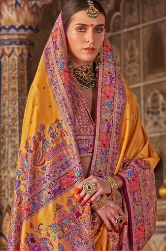 Yellow ethnic motifs embroidered silk blend heavy work saree
