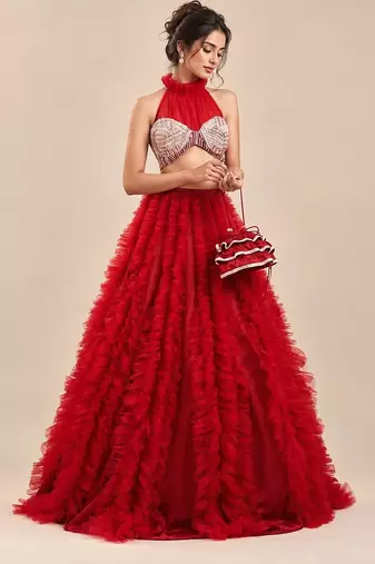 Red Embroidered Mashru Silk Blouse With Ruffle Lehenga And Potli Bag