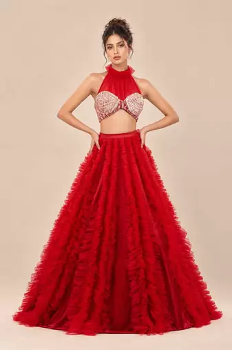 Red Embroidered Mashru Silk Blouse With Ruffle Lehenga And Potli Bag