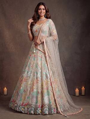 Bewitching White Thread and Multiple Sequins Embroidered Soft Net reception wear lehenga 1
