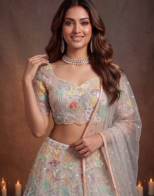 Bewitching White Thread and Multiple Sequins Embroidered Soft Net reception wear lehenga 2