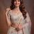 Bewitching White Thread and Multiple Sequins Embroidered Soft Net reception wear lehenga