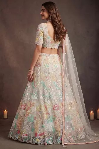 Bewitching White Thread and Multiple Sequins Embroidered Soft Net reception wear lehenga