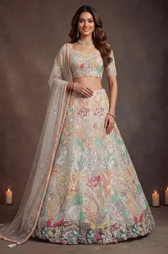 Bewitching White Thread and Multiple Sequins Embroidered Soft Net reception wear lehenga