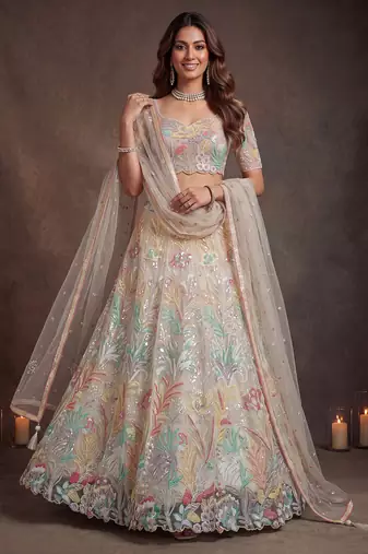 Bewitching White Thread and Multiple Sequins Embroidered Soft Net reception wear lehenga