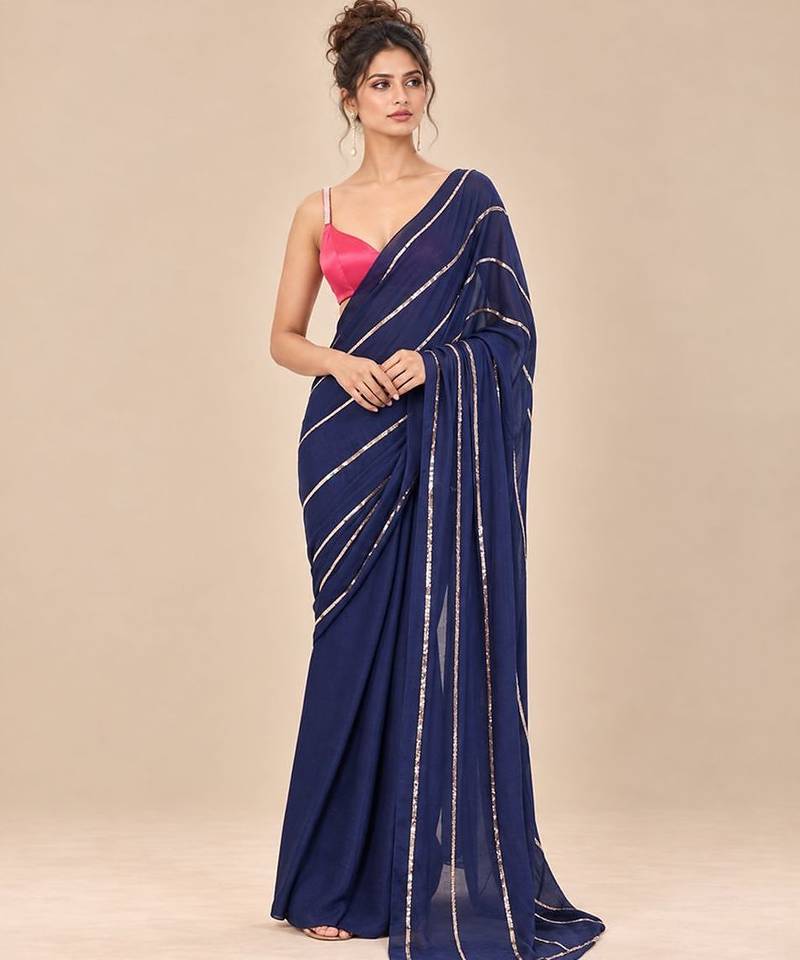Navy blue embroidered saree with hot pink blouse