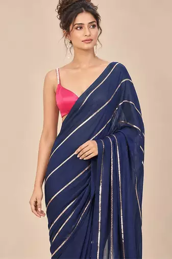 Navy blue embroidered saree with hot pink blouse