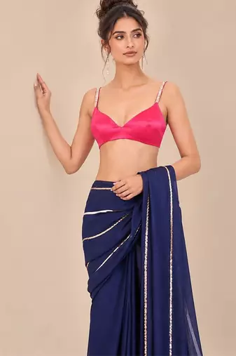 Navy blue embroidered saree with hot pink blouse