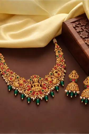 gold-plated temple necklace set with goddess lakshmi design and jhumka earrings
