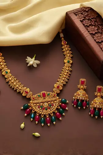 gold-plated stone necklace set with statement pendant and jhumka earrings