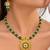 gold-plated copper green bead necklace set with statement pendant