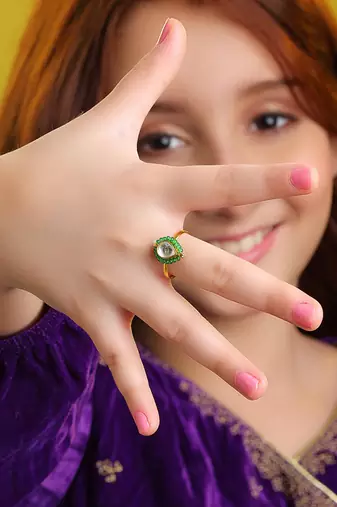 Gold plated kundan green halo ring