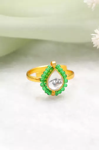 Gold plated kundan green halo ring