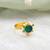 Gold plated kundan green halo ring