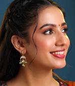Gold plated kundan green jhumka earrings