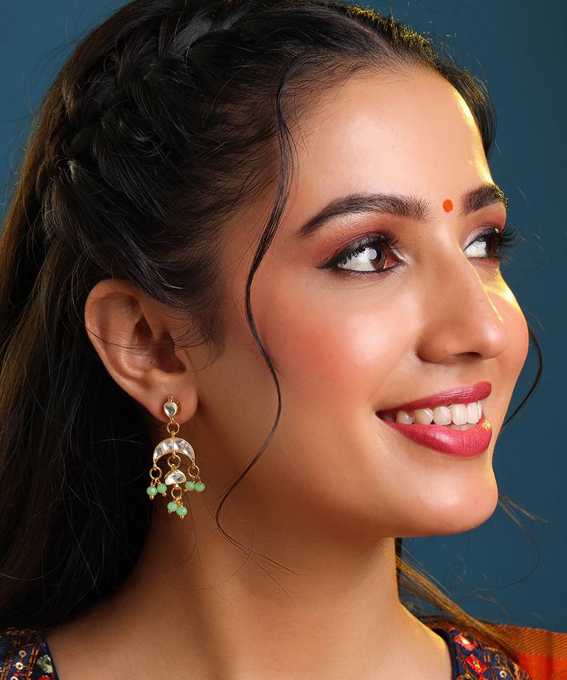 Gold plated kundan green jhumka earrings