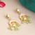Gold plated kundan green jhumka earrings