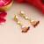 Gold plated kundan maroon drop earrings