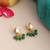 Gold plated kundan green pearl earrings