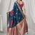teal blue soft silk blend with fancy pom pom detailing festive wear saree