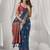 teal blue soft silk blend with fancy pom pom detailing festive wear saree