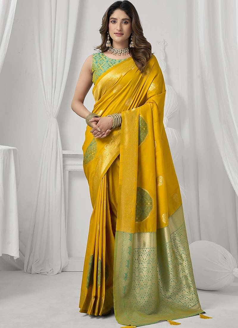 mustard soft silk blend with fancy pom pom detailing festive wear saree