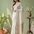 White ethnic motifs woven design banarasi saree with unstitched blouse
