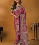 Pink position printed ethnic motifs banarasi saree with matching blouse