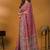 Pink position printed ethnic motifs banarasi saree with matching blouse