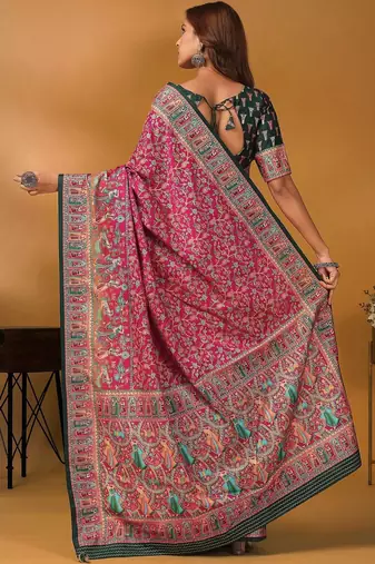 Pink position printed ethnic motifs banarasi saree with matching blouse