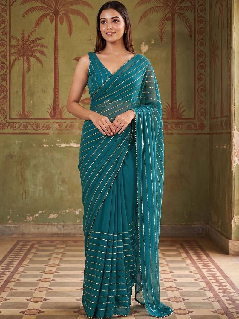 Teal striped sequinned poly georgette designer saree