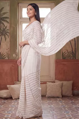 Off white embellished sequinned poly georgette saree